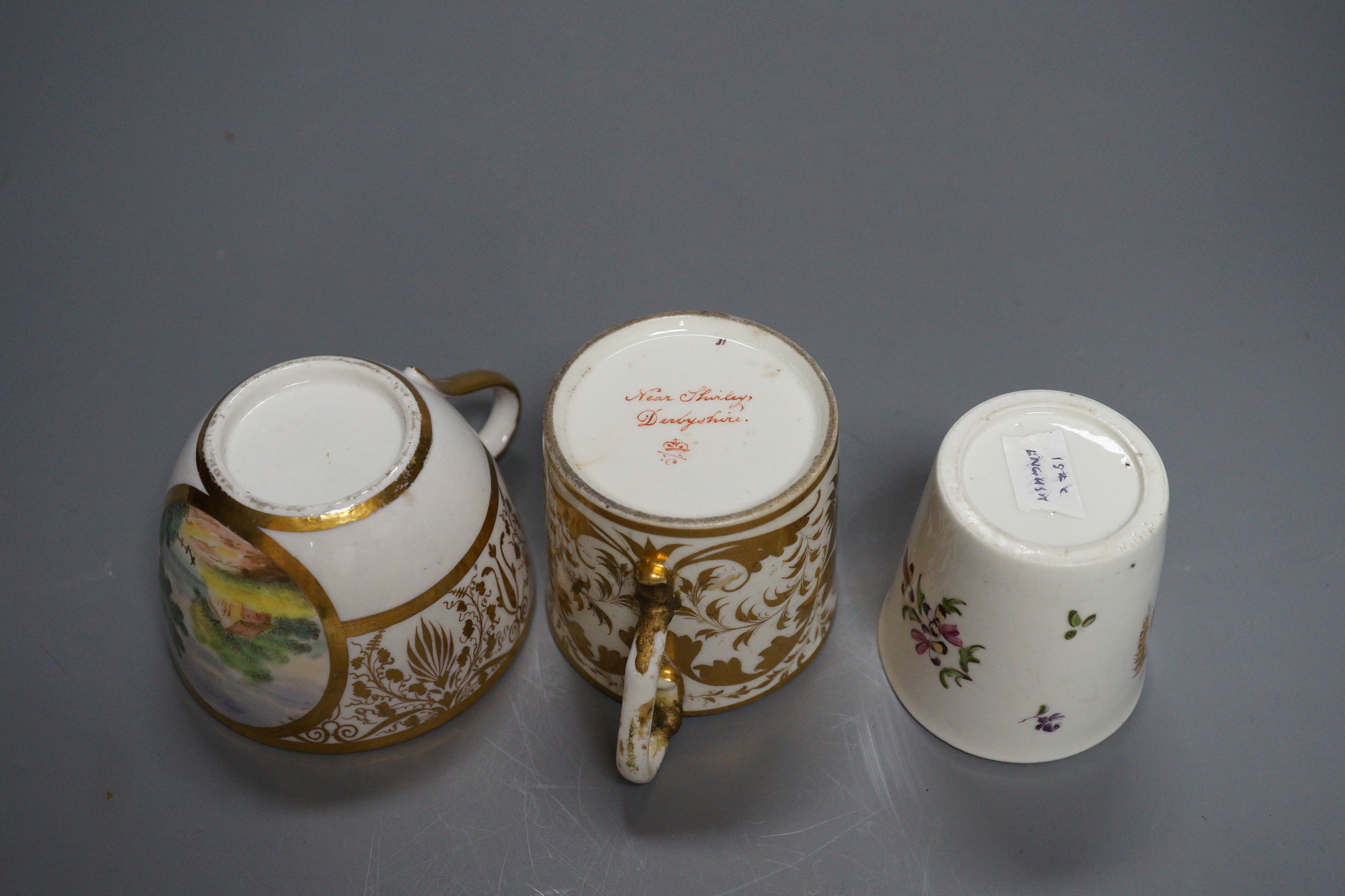 An 18th century miniature porcelain tumbler, probably Derby, a Derby coffee can and a Bute-shape coffee cup